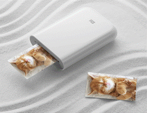 A white rectangular device with a cat image coming out of it  Description automatically generated